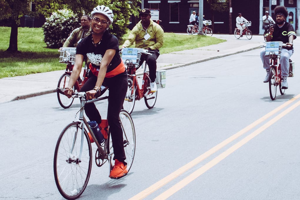 smiling woman riding on bike