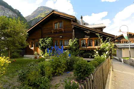 large wooden house in an alpine town