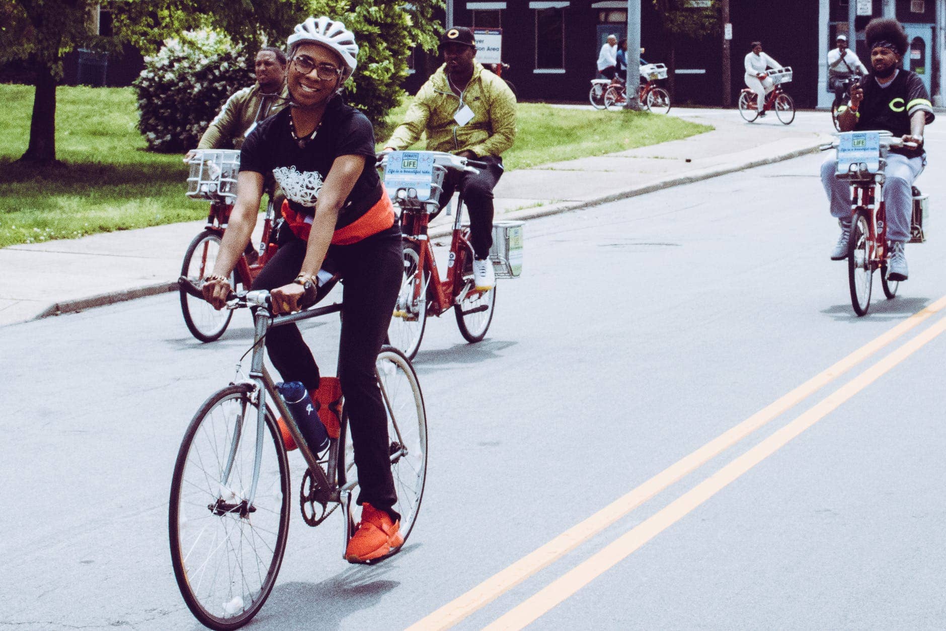 smiling woman riding on bike